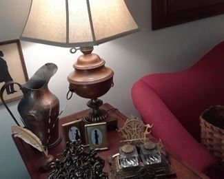 Pair of brass and wood lamps, desk accessories in brass, copper pitcher, and silhouettes, also stoneware ink well and quills