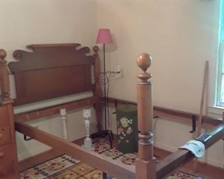 Old rope bed with cannonball posters