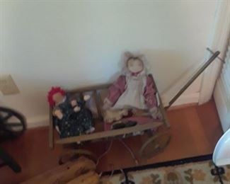 Child's wagon and dolls