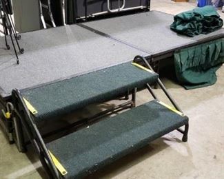 Portable stage unit, sold with stairs and 2 folding platforms (1 unfolded) and skirting