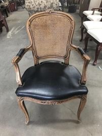 higher end vintage leather and cane chair  
