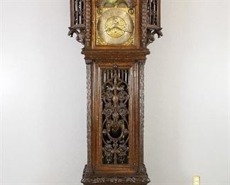 Tobey Gothic Revival Grandfather clock, quarter hour two tune striking on eight bells or four coiled gongs in an elaborate R J Horner hand carved Oak case 
