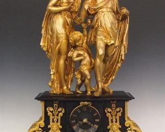 A large 19th century French Figural clock by L. Marti.  8-day time and strike movement with Roman numerals on a Black Slate dial.  Black Slate case with Gilded spelter mounts and figures of Venus and Adonis with a young Cupid between them.