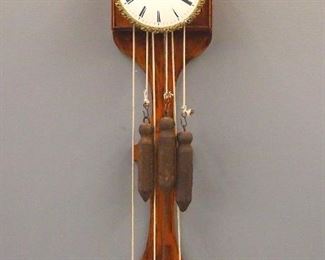 A late 18th century Austrian Brettluhr wall clock marked "Brettuhr Leopold, Kroner" on dial.  Brass enclosed 30 hr time and strike movement with quarter hour Grand Sonnerie strike, one piece convex porcelain dial with Roman numerals and Brass Piecrust bezel.  Walnut case with upper gong housing and banjo form lower section.
