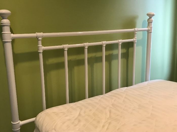 White metal bedframe with mattress size full