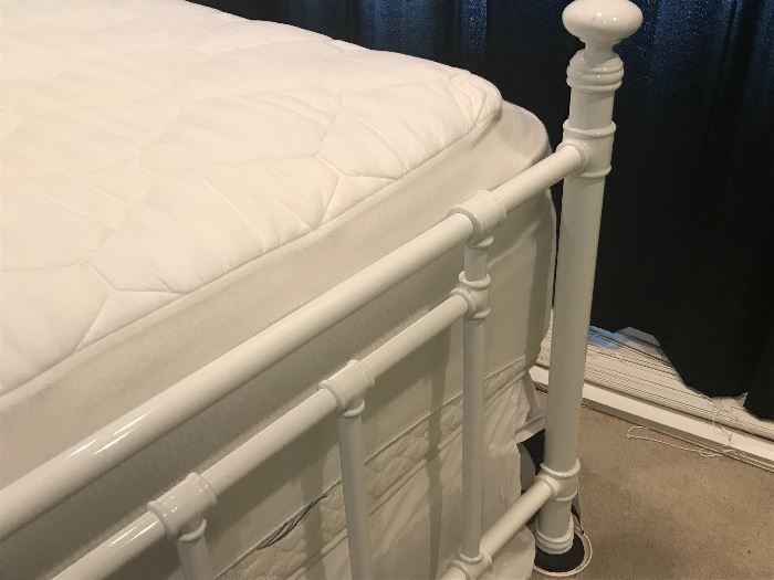 White metal bedframe with mattress size full