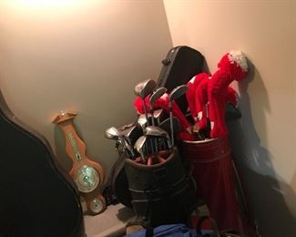 Golf clubs & wall barometer