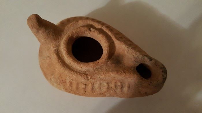 This is a Very Nice Ancient Roman Terracotta Oil Lamp, dating 100-200 AD.
Original archaeological oil lamp, museum quality. Discovered inside old Roman walled city of Lugo, Galicia, Spain. In 13 BC on  the positioning of a Roman Legion military camp, while the Roman Empire completed the conquest, in the North, of the Iberian Peninsula Situated in what was the Roman Province of Hispania Tarraconensis, it was the chief town of the tribe of the Capori. Though small it was the most important Roman town in what became Gallaecia  during the Roman period, the seat of a conventus, one of three in Gallaecia, and later became one of the two capitals of Gallaecia, and gave its name to the Callaïci Lucenses. It was centrally situated in a large gold mining region, which during the Roman period was very active. Today this Roman city is called Lugo in Galicia, Spain.This roman oil lamp was excavated from inside the city wall during some archaeological excavations between 1883 and 1887. Some very ide