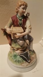 Vintage Porcelain Figurine Andrea by Sadek “The Bird Whisper" of a young boy dressed in Colonial attire sitting on a tree stump holding a bird cage with both hands while the bird is resting on his shoulder.
This is an extraordinary and rare Andrea by Sadek figurine made of porcelain this piece is in excellent condition, there are no chips or cracks.