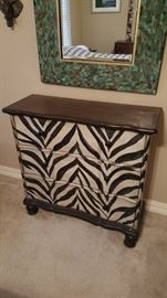 HAND PAINTED ZEBRA PRINT ACCENT CHEST
THIS HAND-PAINTED ZEBRA PRINT CHEST WILL ADD STYLE TO YOUR HOME DÉCOR. THIS ACCESSORY FEATURES A HAND-PAINTED ZEBRA STRIPES FINISH THAT WILL GIVE YOUR HOME AN EXOTIC FLAIR…. DIMENSIONS H. 34”X L. 35”X W. 13”
