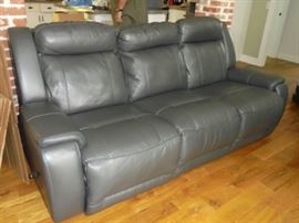 Gray leather couch w/recliners on both ends. 2 yrs old