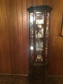 Fabulous lighted glass shelf display cabinet...great small size with mirror back.
