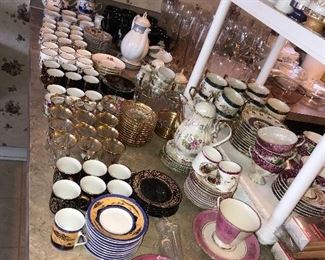 TEA CUPS AND SAUCERS