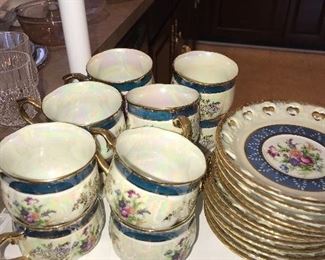 TEA CUPS AND SAUCERS