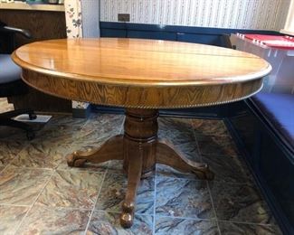 Solid oak 48” diameter round table with one 12”W leaf 