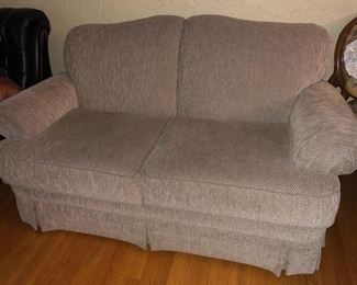 Neutral colored 64” wide upholstered couch - $250   