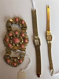 A pair of womens watches and vintage belt buckle