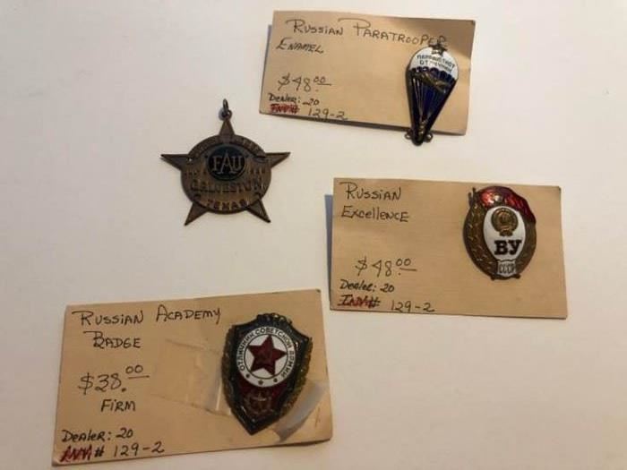 Antique Russian badges and one other
