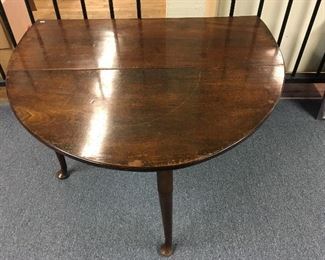 Period drop leaf table. Low estimate $250