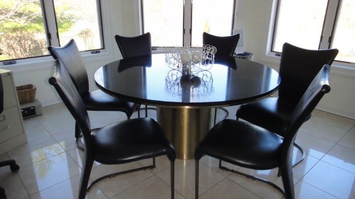 Anello Table 60” diameter Andes black granite top with bronze satin barrel base (designer George Mulhauser), 6 Chairs. Matching bar stools