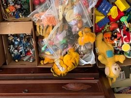 More toys. Stuffed animals, dolls, action figures. 