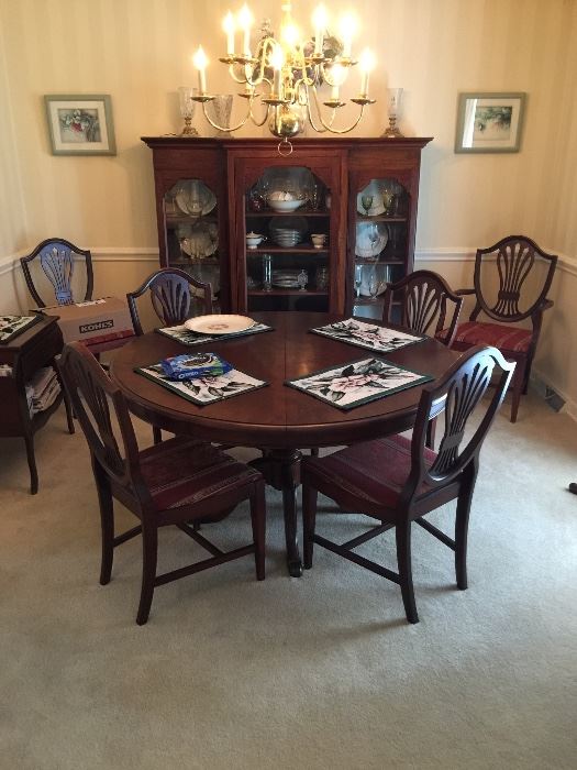 Beautiful Cherry table with shield back chairs. China cabinet is not for sale