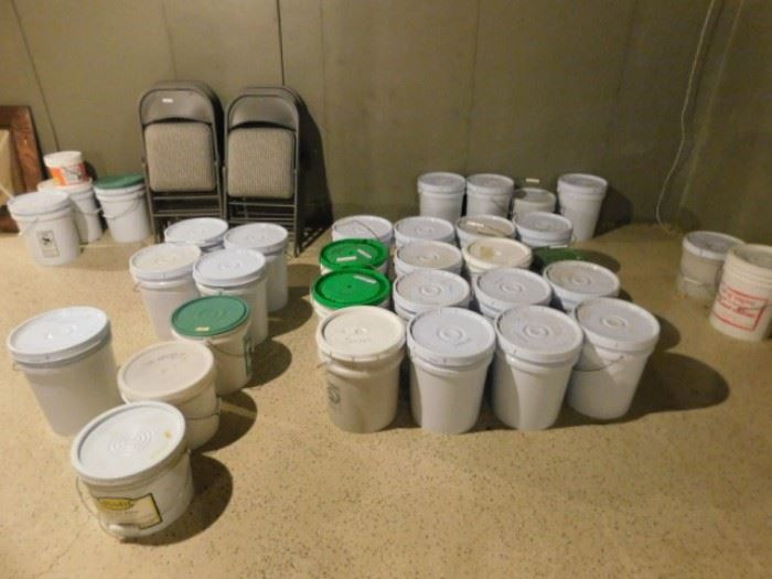 Buckets of prepping items seeds and beans