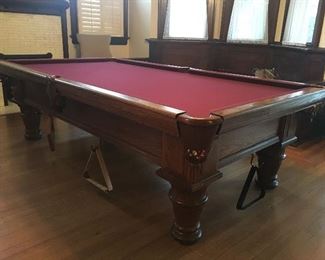 You are looking at a Schmidt full size billiard table with accessories.