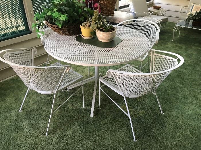 Mid Century wrought iron table / 4 chairs $ 280.00