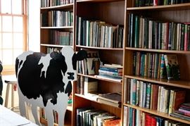 Books and a Woody Jackson Cow - Woody Jackson did all of Ben & Jerry's Ice Cream cows.