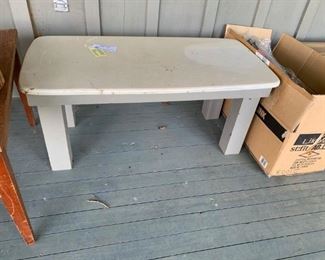 #32 oval coffee table Corian top wood base $40.00