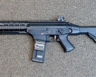 LOT # 39 - SIG-SAUER "SIG 556" SHORT BARRELED RIFLE - CLASS III FIREARM                                                                           AUCTION ESTIMATE - $2,500.00 - $2,800.00                                 CALIBER 5.56, KALASHNIKOV OP SYSTEM, SIDE GOLDER, NO LONGER BEING MANUFACTURED, CONDITION IS NEW IN FACTORY BOX