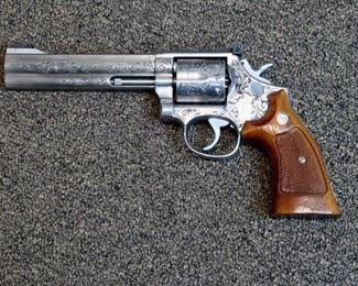 LOT # 61 - SMITH & WESSON MODEL 686 STAINLESS STEEL REVOLVER                                                           AUCTION ESTIMATE - $3,000.00 - $3,500.00                                                                                                         CALIBER .357 MAG., REPORTED TO BE ENGRAVED BY FRANK HENDRICKS,  CONDITION IS NEW WITHOUT BOX
