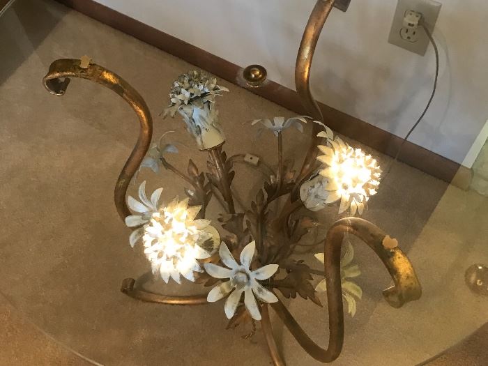 An end table with a metal floral sculpture that actually lights up!
