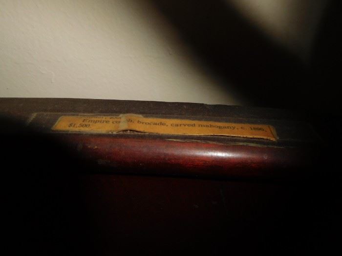 sign on couch stating 1500 purchase price when made?