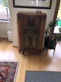 Antique radio converted to a bar! Top opens and the face of the radio opens like a door 25.5"w x 41.5"h x 15.5"d Asking $240 asking $60 for the plant