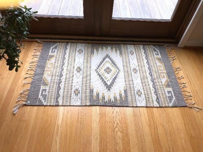 A woven wool rug for sale 4'6 x 2'6" asking $220