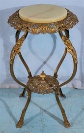 283a Brass Victorian pedestal with onyx top and ladies heads on legs, 32 in. T, 18 in. Dia.