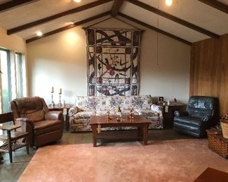 Vintage school desk,Coffee table, end tables, two recliners, couch and handmade Quilt.