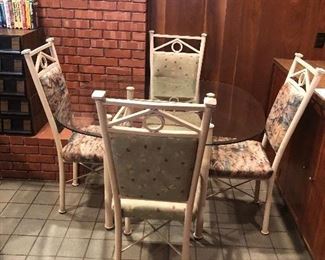 Glass table with four chairs