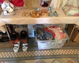 Snow boots, tub of baby clothes