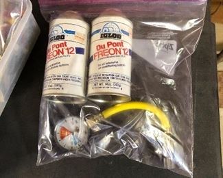 DuPont Freon cans (2) and gauge with hose connector