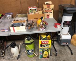 Several chemical sprayers, wood chipper, airless paint gun like new, misc elec parts, plumbing parts, vintage pickup radio, garden hand tools