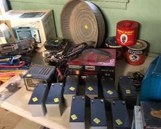 New batteries, oil collection can, Sir Walter Raleigh collectible tobacco cans, 1950s and 60s car radios, battery chargers