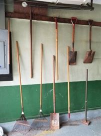 Vintage yard tools, old wood and heavy steel construction