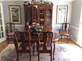Beautiful dining room table and chairs and matching china cabinet