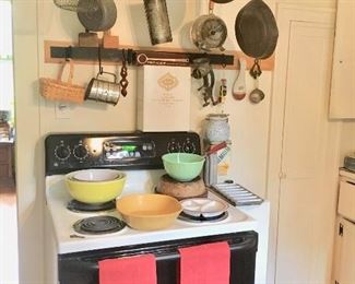 GE electric stove, hanging pot rack,  & kitchen collectibles