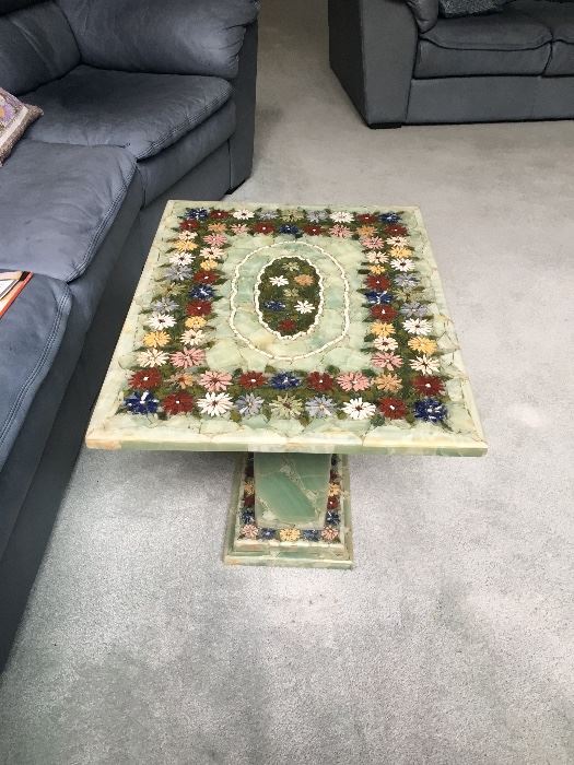 There are 2 of these floral art Italian marble end tables