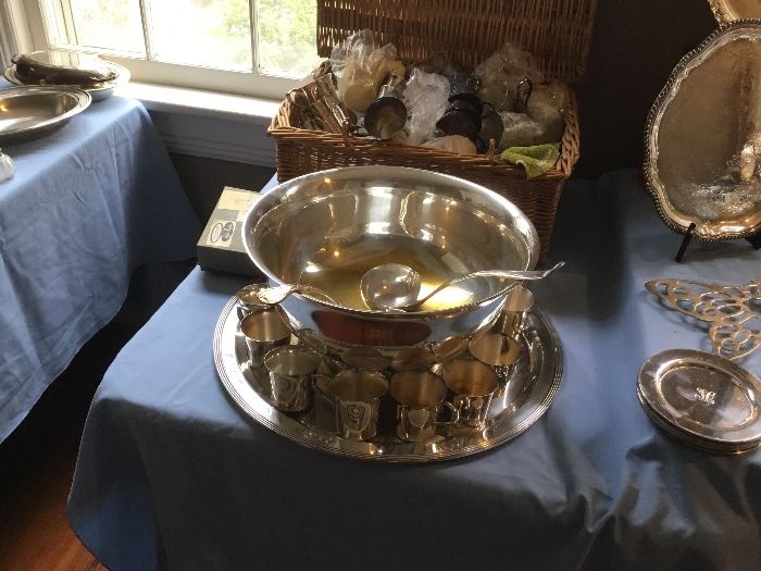 Revere punch bowl with lots of punch cups. All silver plate.