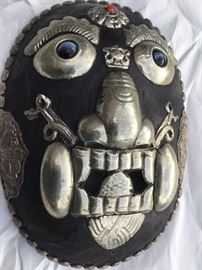 Tibetan carved wooden mask with silver mounts